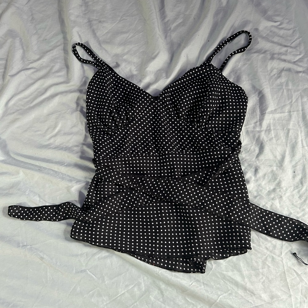 Cute black and white poka dot shirt.